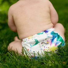 Load image into Gallery viewer, Lava Rumparooz One Size Cloth Diaper on a chubby baby sitting outside in the grass
